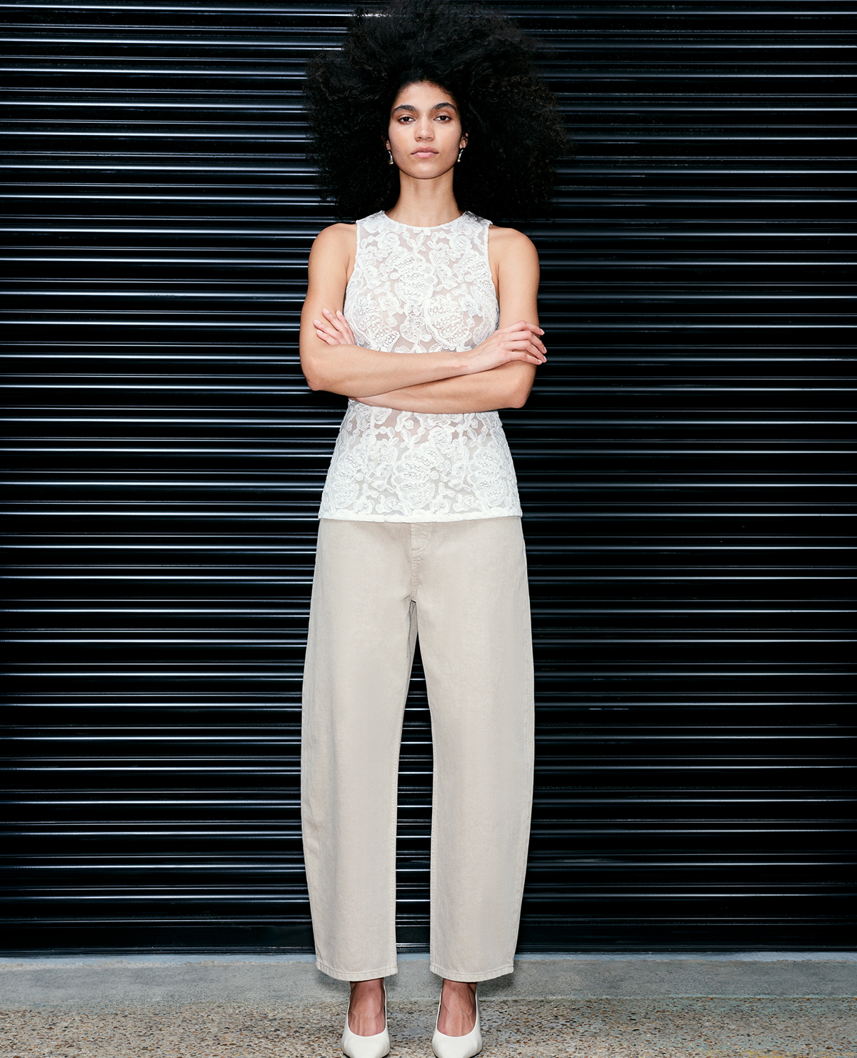Woman wearing Lace Fitted Tunic Shell Top in Soft White with Mid Rise Barrel Jeans in Ecru