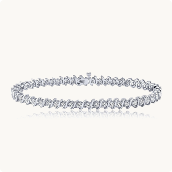 S-Link 2ct. Diamond Bracelet in 14k White Gold: Diamond tennis bracelet with an S-link white gold design lined with round diamonds.