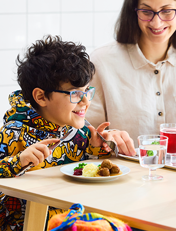 Boy eating IKEA meatballs