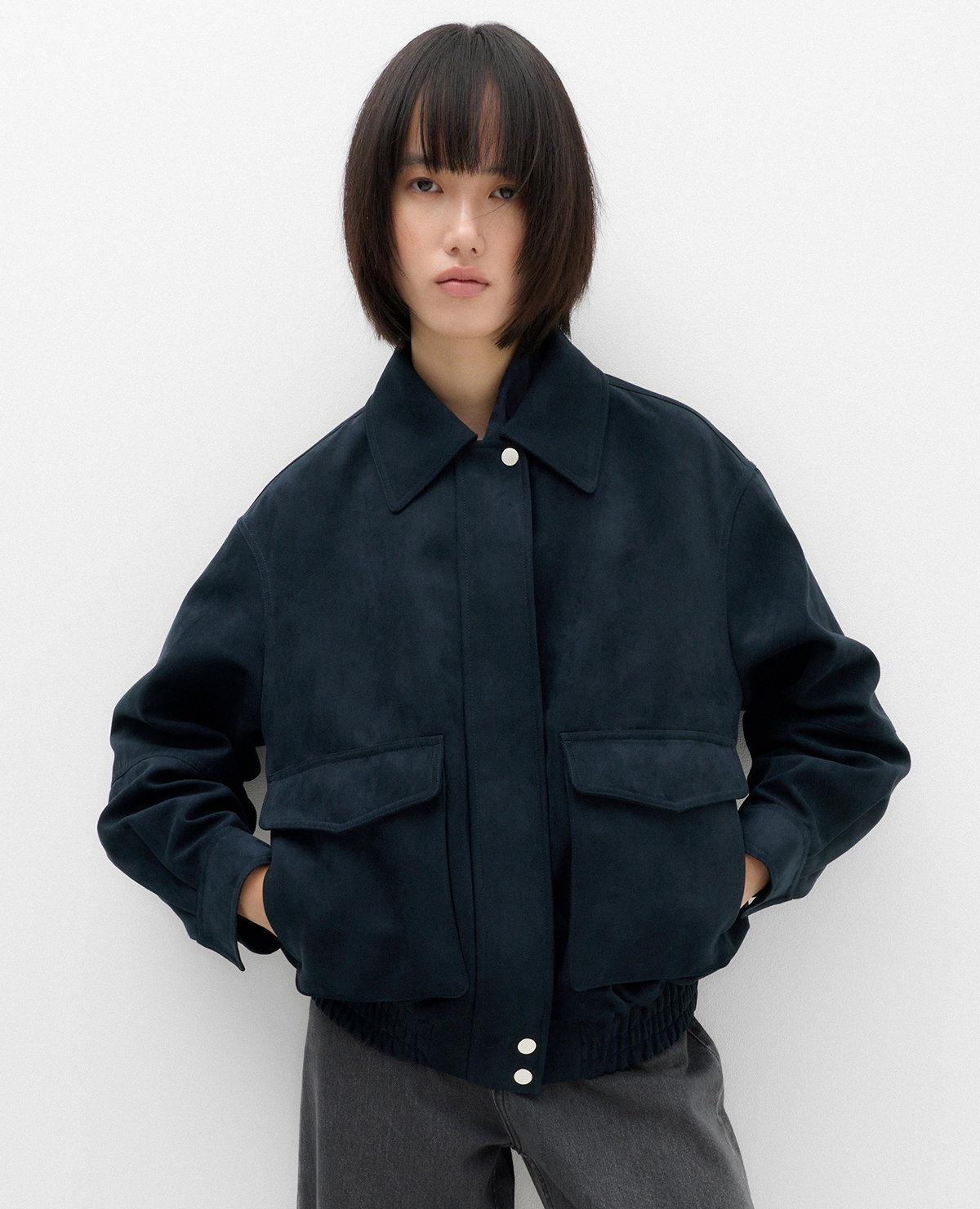 Woman wearing a Midnight Navy Suedette Bomber Jacket