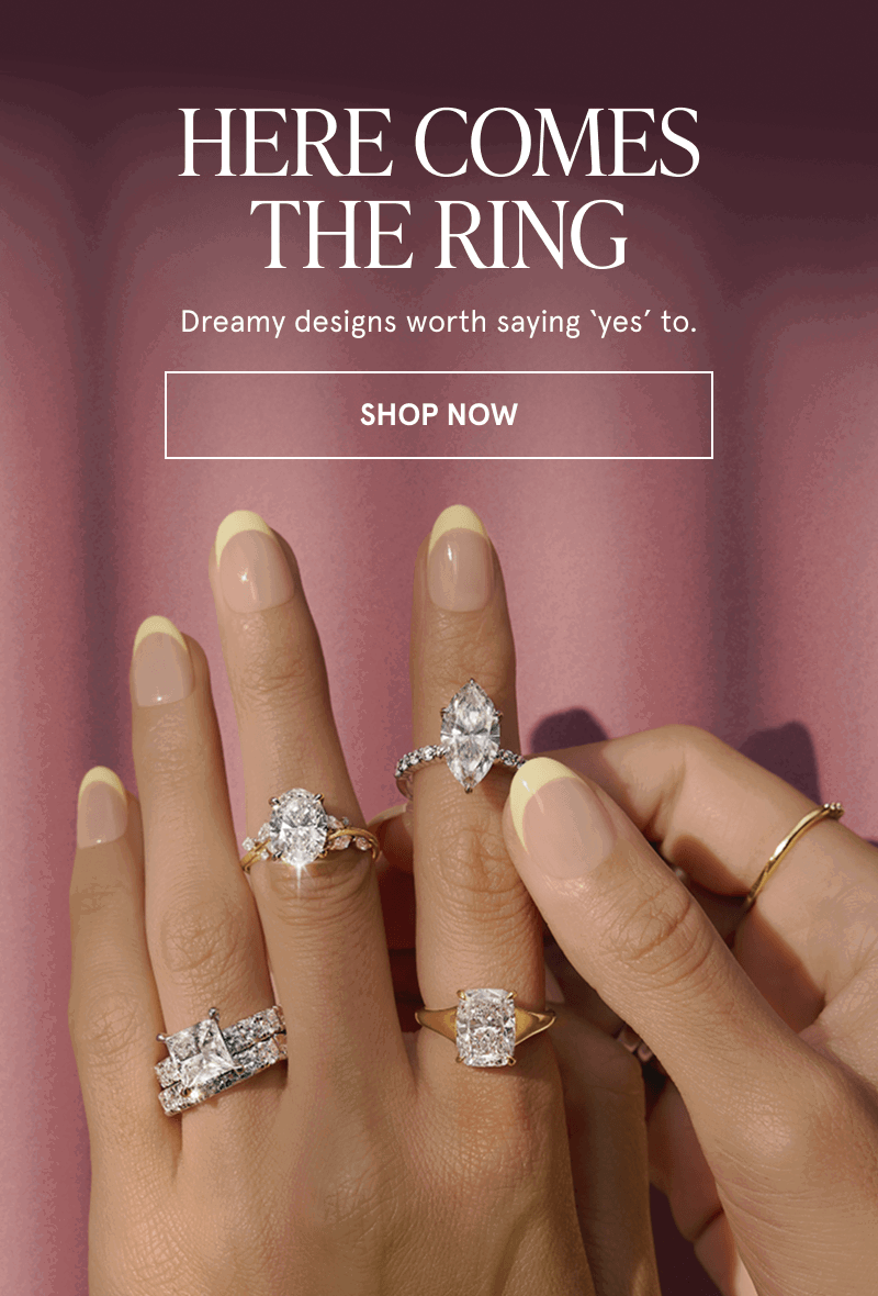 Model with diverse shaped diamond engagement rings.  Here comes the ring. Click here to shop now
