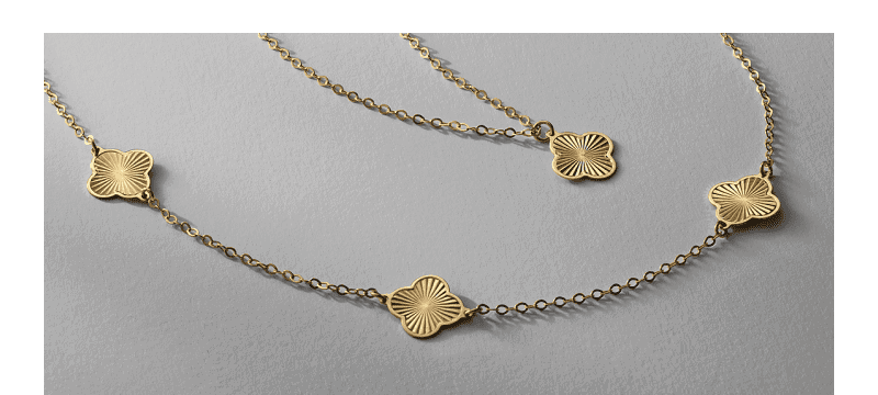 Gold station necklace featuring clover-shaped motifs on a fine chain.