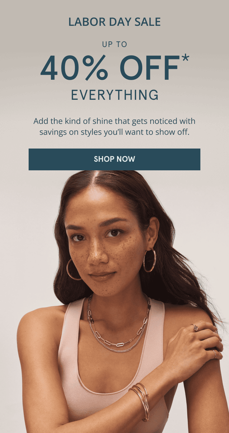 Labor Day sale. Up to 40% off everything. Click shop now. A model wearing layered gold jewelry.