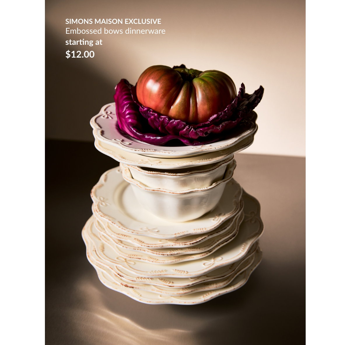 A stack of plates. A Simons Maison Exclusive, Embossed bows dinnerware starting at 12 $