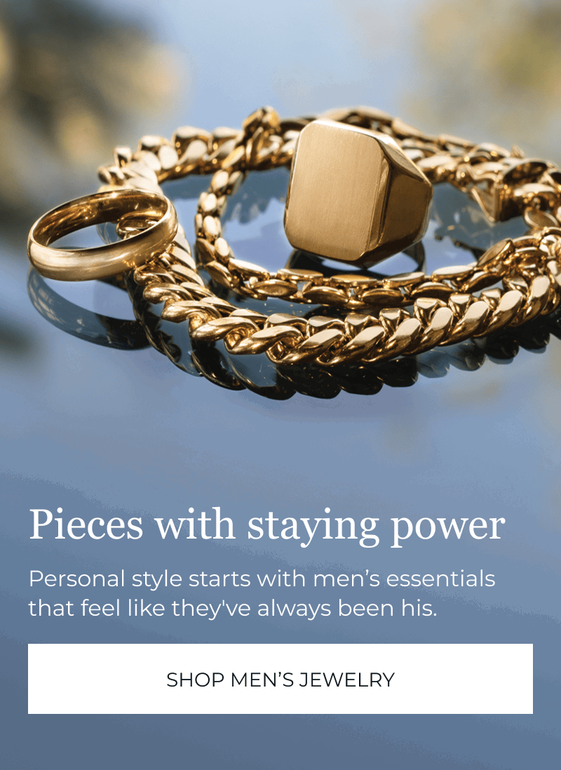Men’s gold jewelry on reflective surface. Pieces with staying power. Personal style starts here. Click to Shop Men's Jewelry