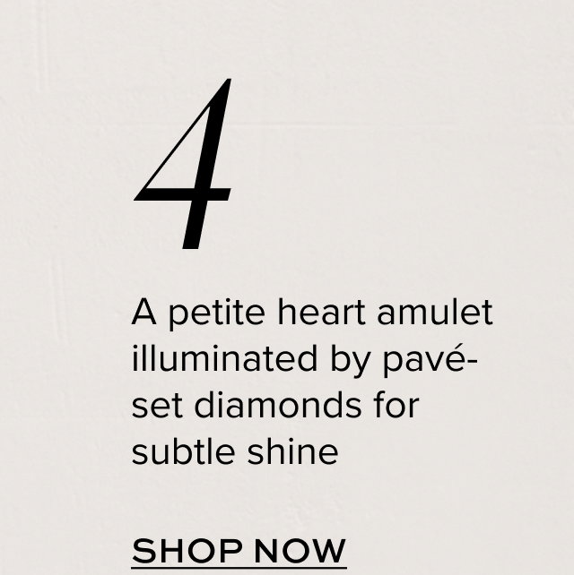 4. A petite heart amulet illuminated by pave-set diamonds for subtle shine