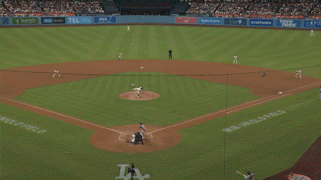 An animated gif of Tommy Edman making a leaping catch against the fence