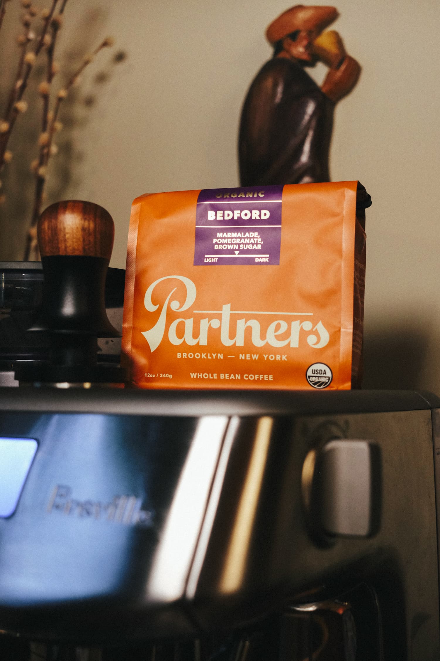 A bag of Partners Coffee's Bedford - Organic on top of a Breville espresso machine 