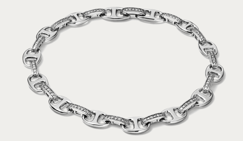 Diamond-accented link necklace in white gold with interlocking oval links.