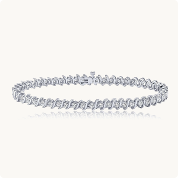 S-Link 2ct. Diamond Bracelet in 14k White Gold: Diamond tennis bracelet with an S-link white gold design lined with round diamonds.