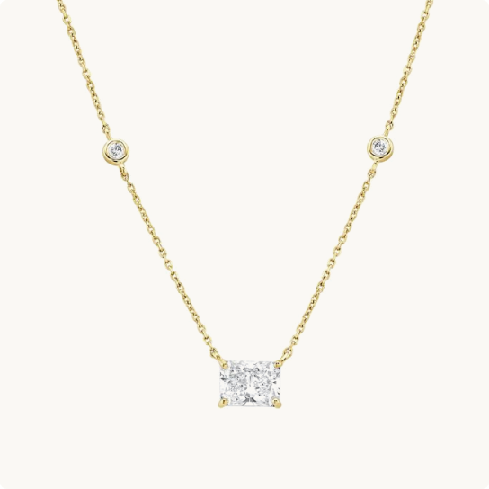 Lab Grown Diamond 1 1/4ctw. Station Necklace in 14k Yellow Gold: Radiant-cut diamond pendant necklace with two small bezel-set diamond stations along the chain, in yellow gold.