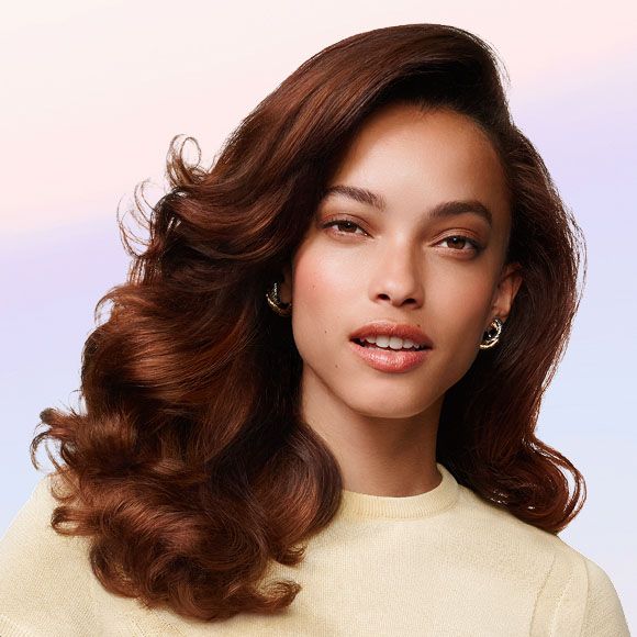 Model shows off her styled hair.