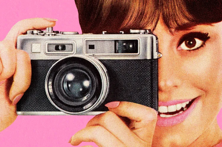 A picture of someone holding a camera | CSA-Printstock