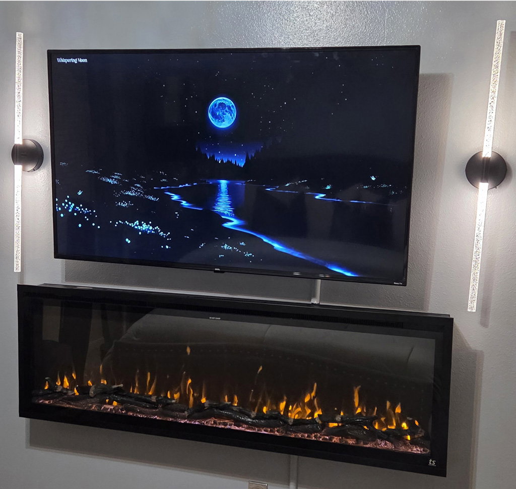 Touchstone Sideline Elite 60 Smart Electric Fireplace wall mounted in guest room