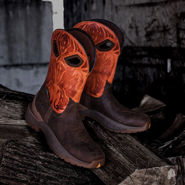 A pair of stinger boots in brown and orange.