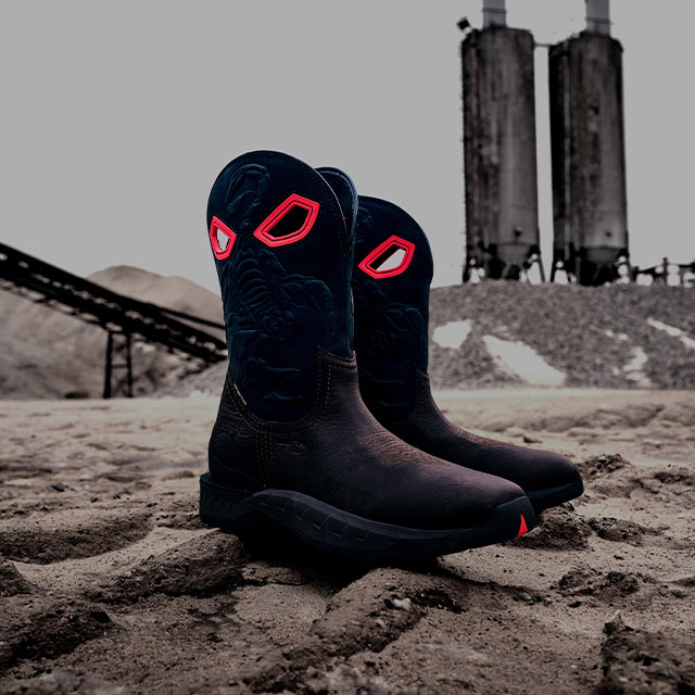 A pair of stinger boots in brown and red.