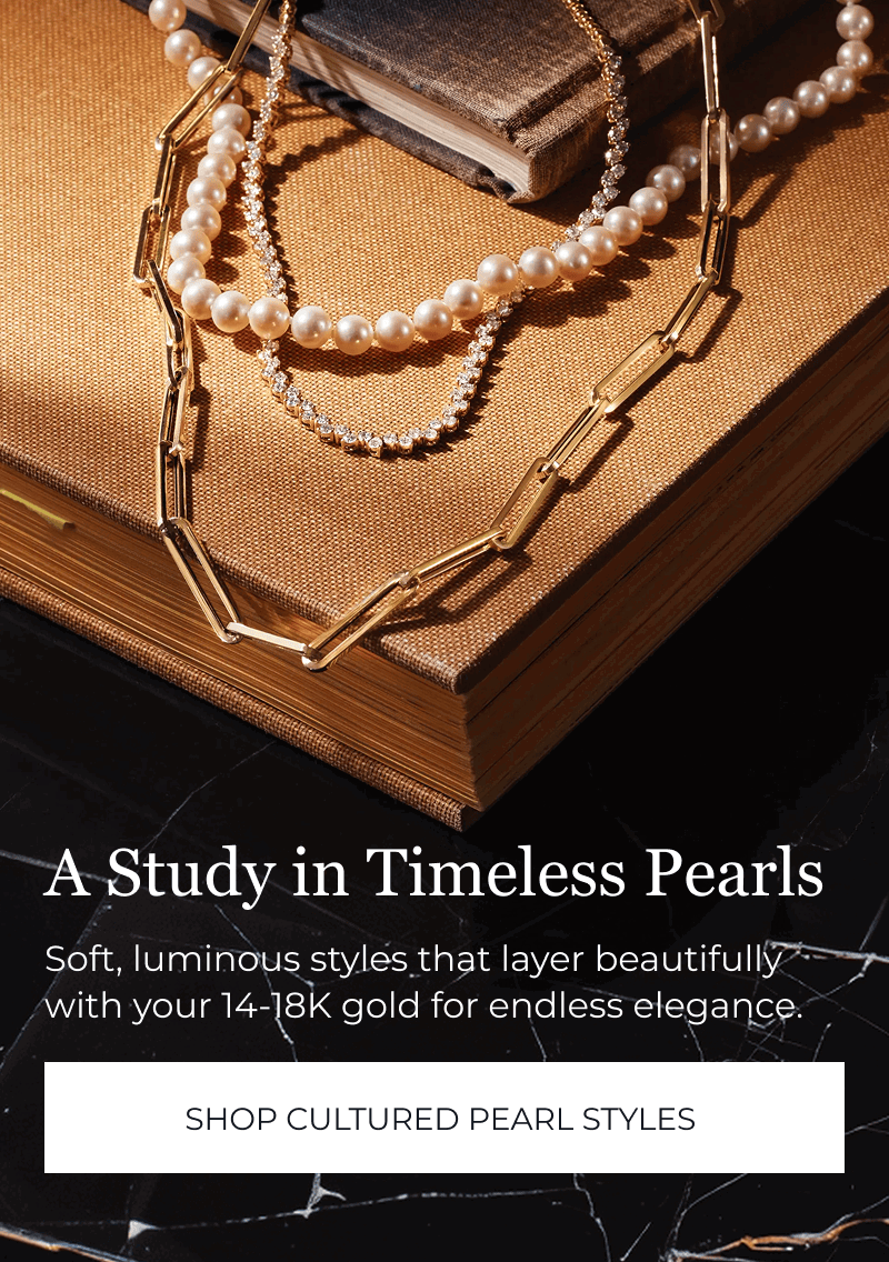 Pearls and gold chains layered on book. A Study in Timeless Pearls with your 14-18K gold. Click to Shop Cultured Pearl Styles