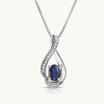 Oval-Cut Sapphire & Diamond Swirl Pendant in Sterling Silver: Oval blue sapphire pendant necklace set within a diamond-lined infinity loop design in white gold, on a box chain.