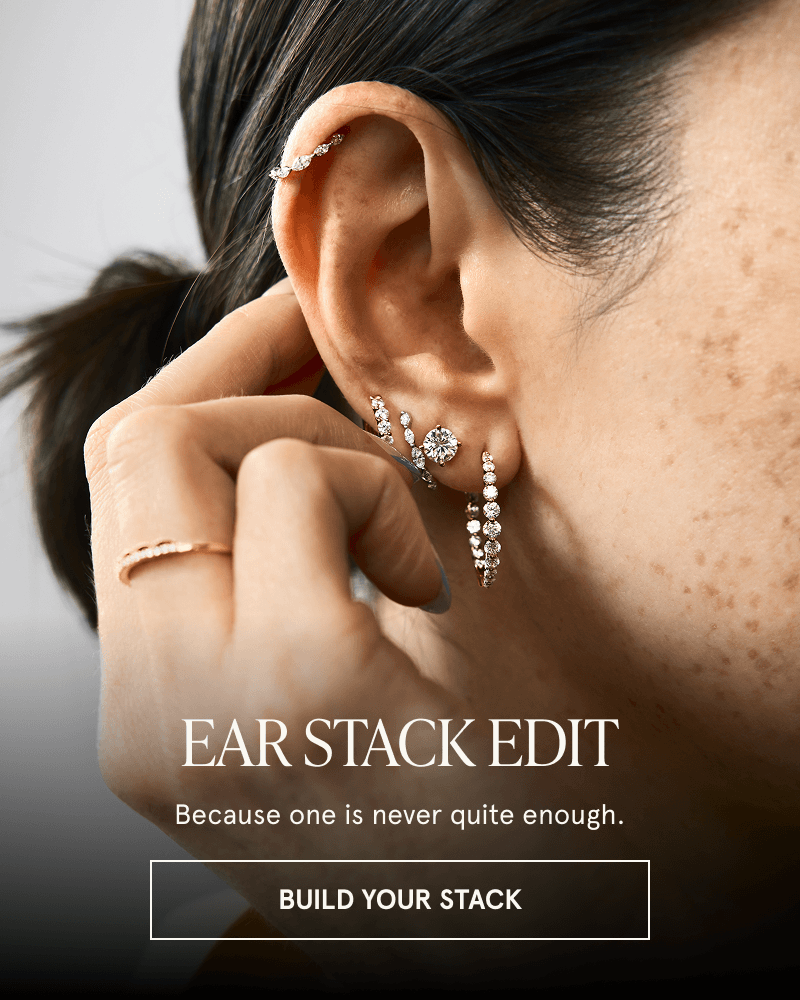Close-up of model showcasing a curated diamond ear stack. Ear Stack Edit. Click here to build your stack