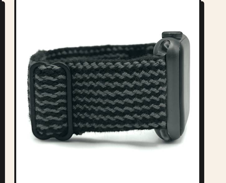 Close-up of a wrist with a Charcoal Braxley watch band.