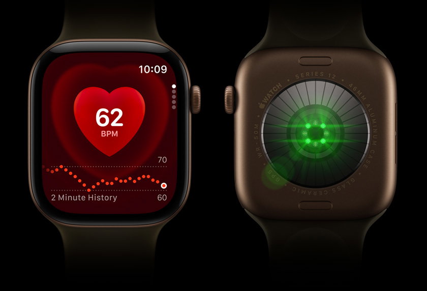Two Apple Watch Series 12 devices side by side; Front-view of Apple Watch Series on left, screen displays heart rate monitor; Back-view of Apple Watch Series 12 on right, lights shine bright, color green