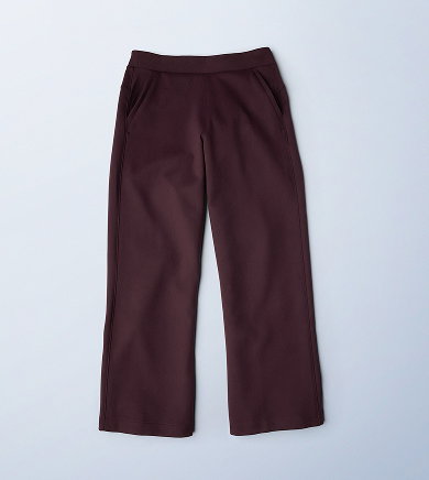 Flatlay of a maroon pair of sweat pants.