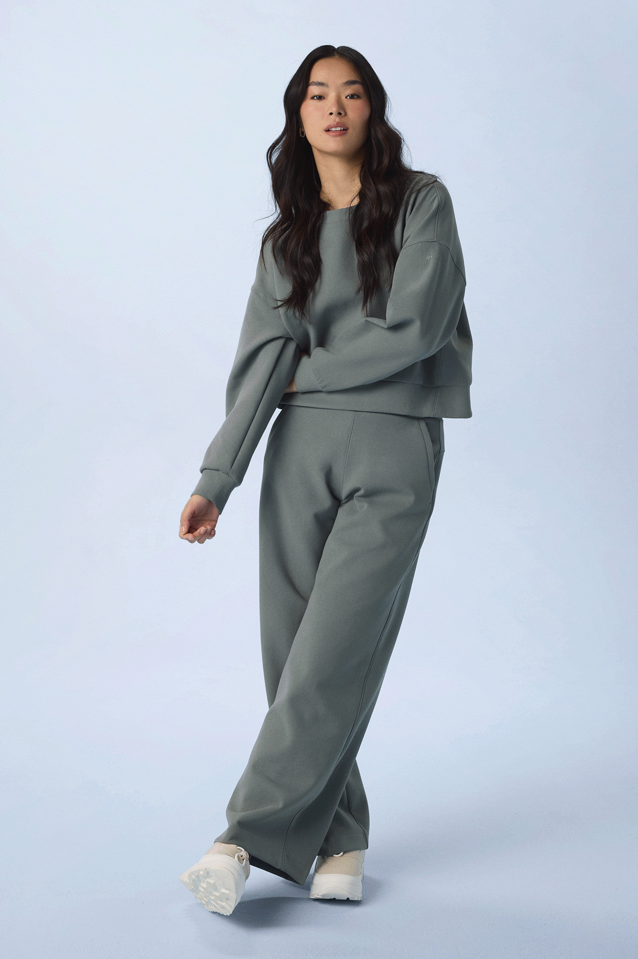 Rotating gif of women wearing colorful sweats.
