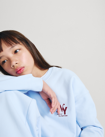 Girl wearing a Light Blue 2 Piece NY Sweatshirt and Joggers Set