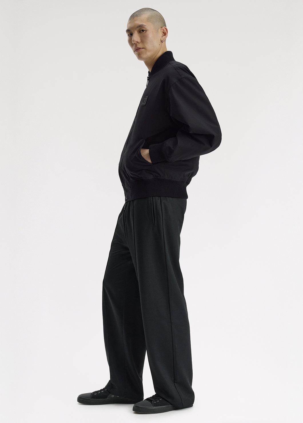 Male model wearing a Fred Perry Leather Patch Bomber Jacket 