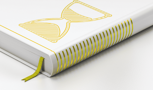 A white hardcover book with a yellow hourglass design on the cover and yellow striped edges. The book has a yellow ribbon bookmark.