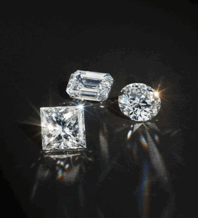 Three loose diamond stones.