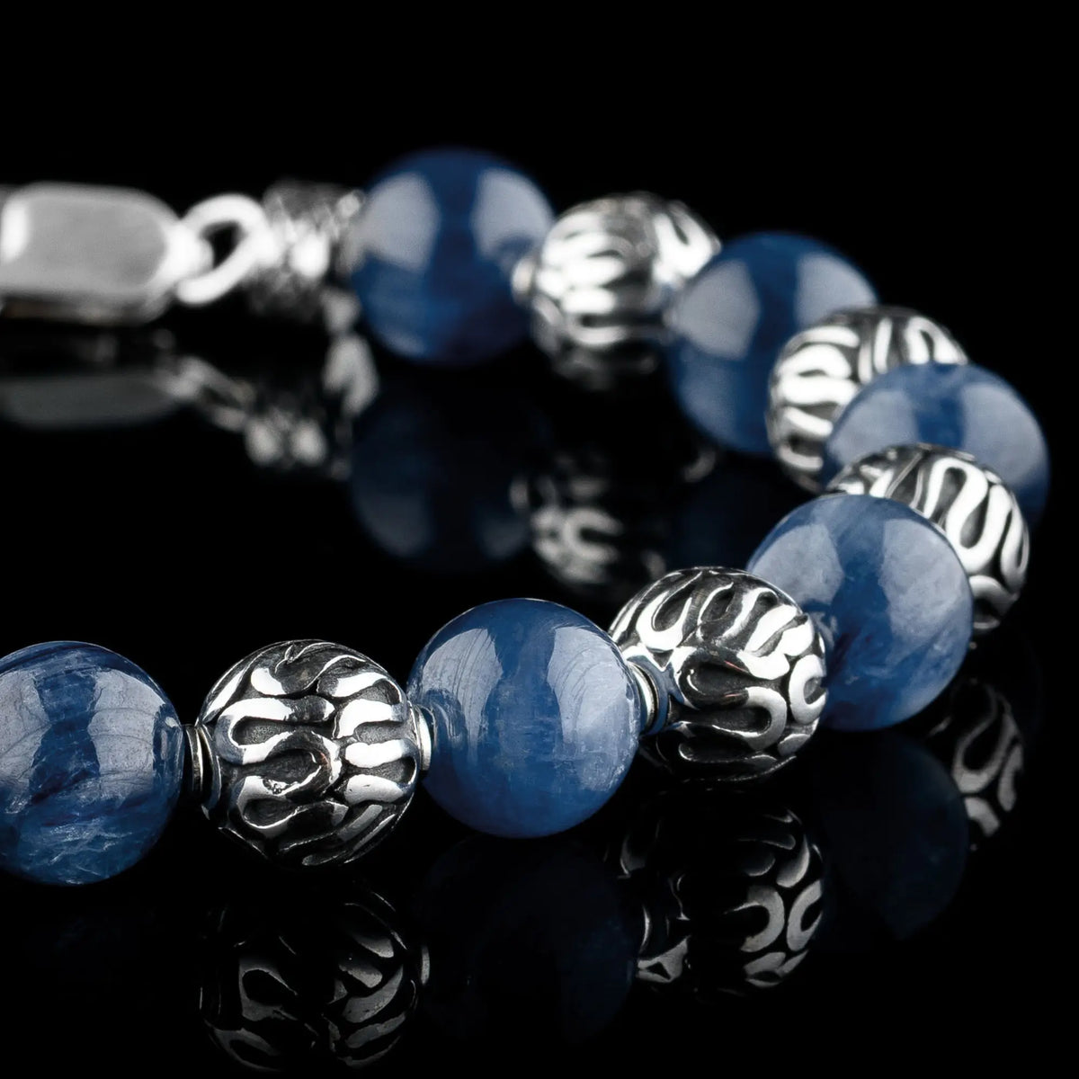 Close-up of Kyanite Bracelet VII, with round 9mm blue stones and ornate sterling silver beads.