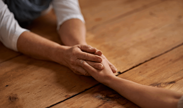 Images of two people holding hands