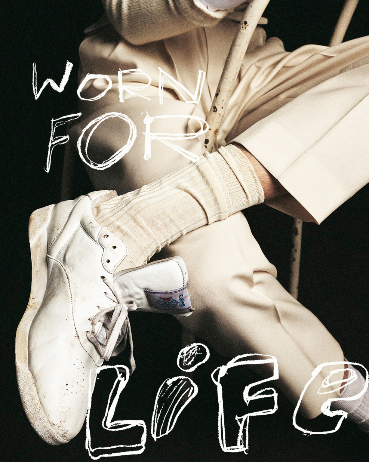 CELINE and Reebok Freestyle Lo sneaker styled with cream tailoring, featuring “Worn for Life” campaign artwork.