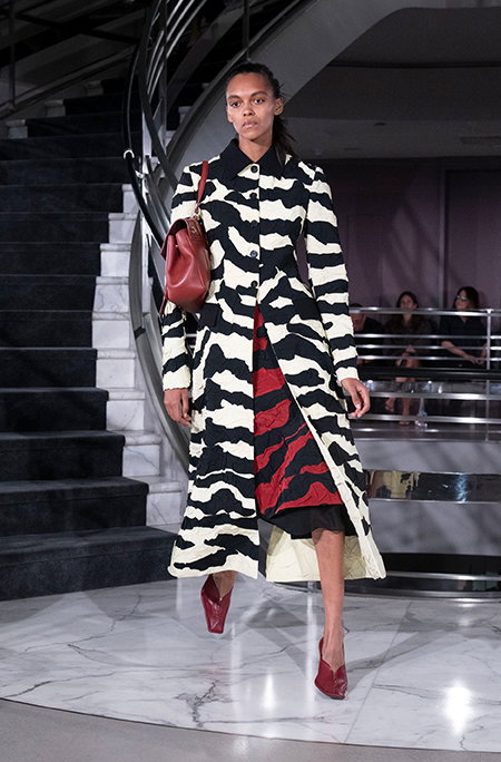 Front image of model on runway wearing Look 1 from the spring-2027 Runway Collection