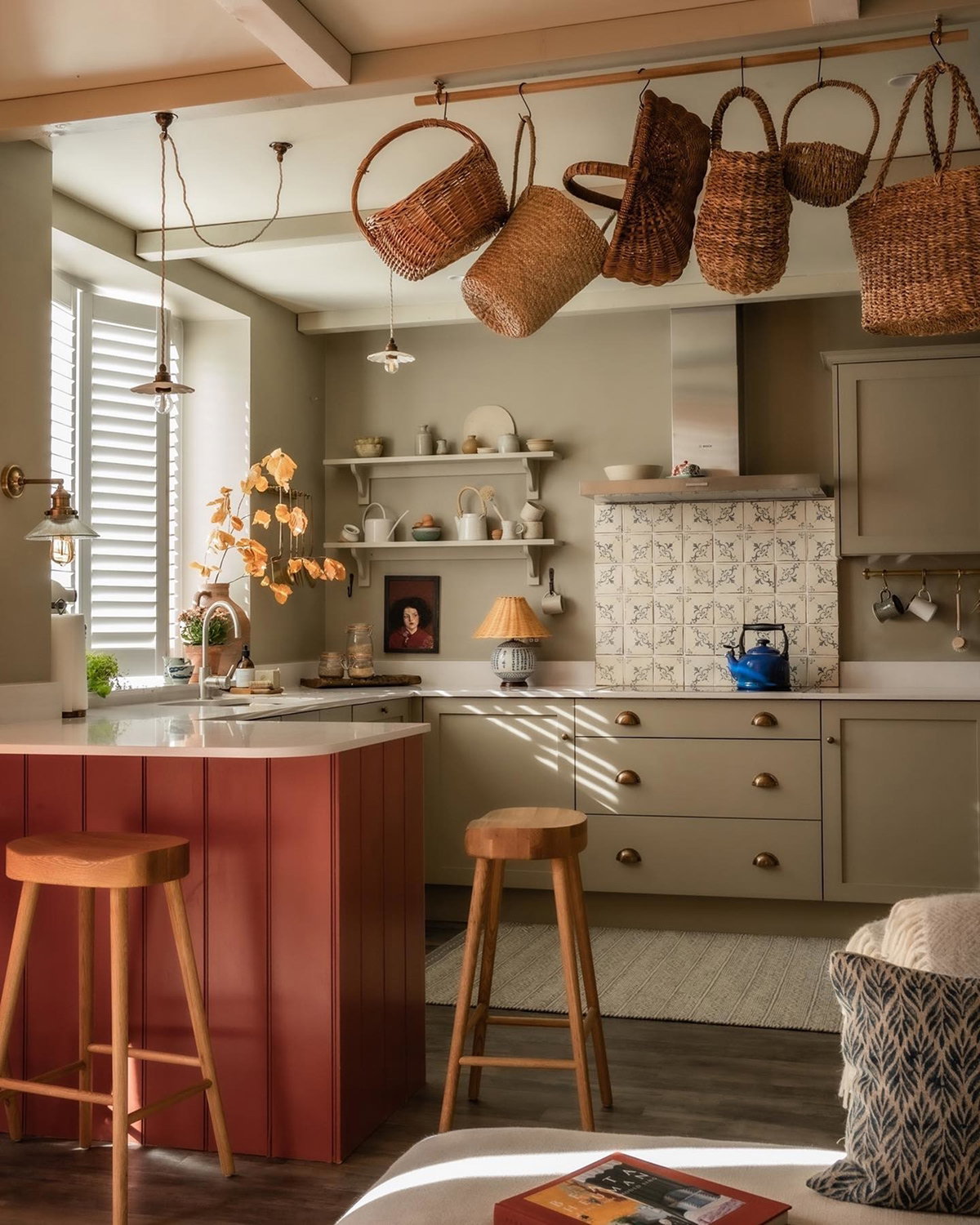 Kitchen painted in Farrow & Ball Light Gray, featuring warm cabinetry, open shelving and natural wood accents.