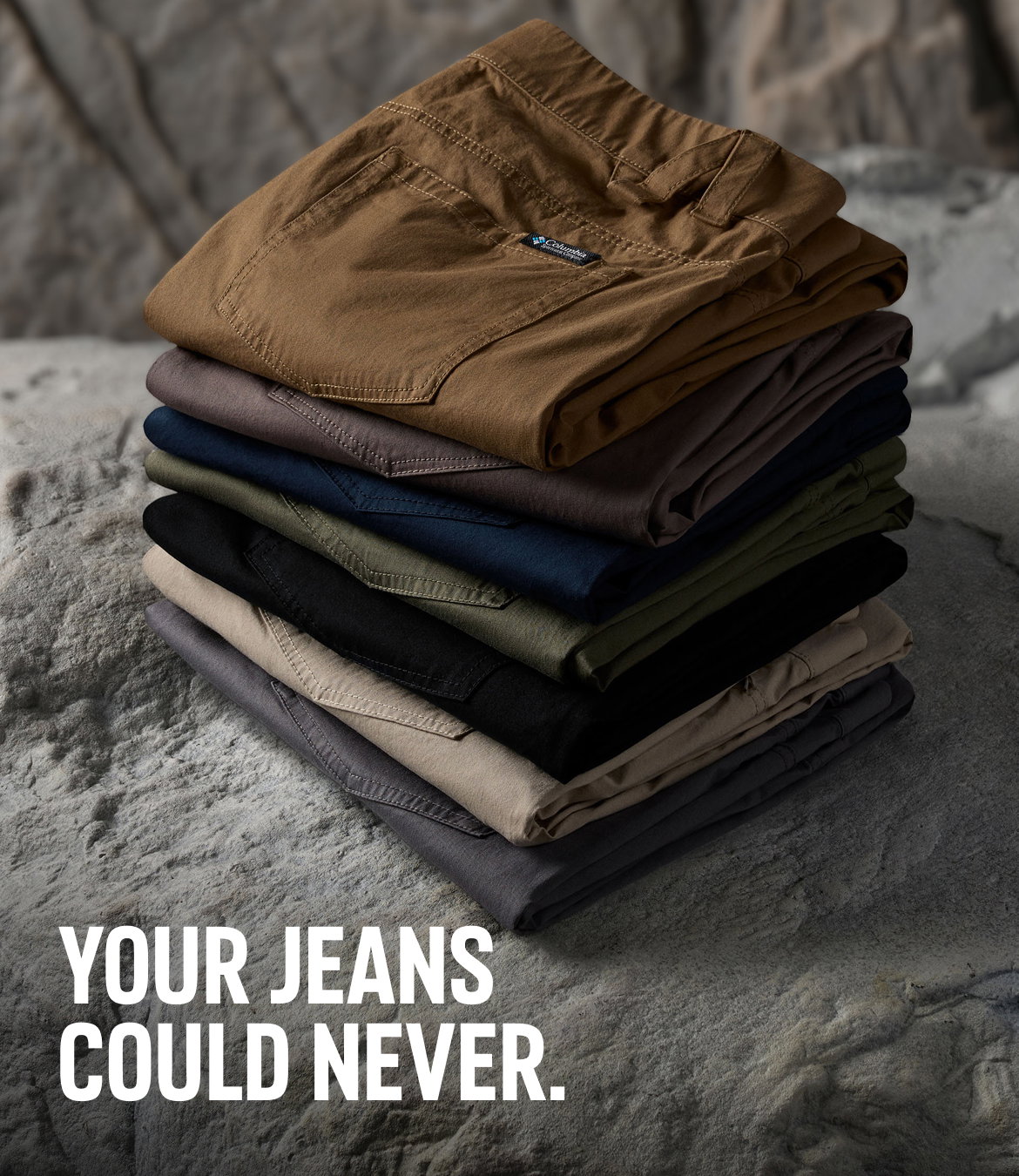 A stack of colorful pants against a rocky background with text: YOUR JEANS COULD NEVER.