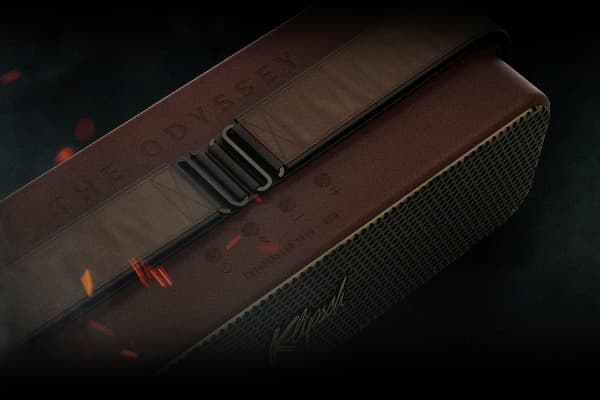 Top-down view of the strap of the Klipsch x Odyssey speaker on a fiery and smokey background.