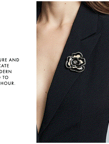 Black and white floral metal brooch with crystals