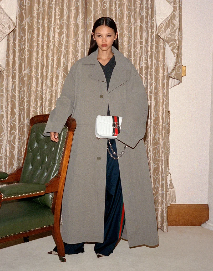 Layer an oversized trench over sleek track pants and point-toe pumps for the new easy-chic off-duty uniform