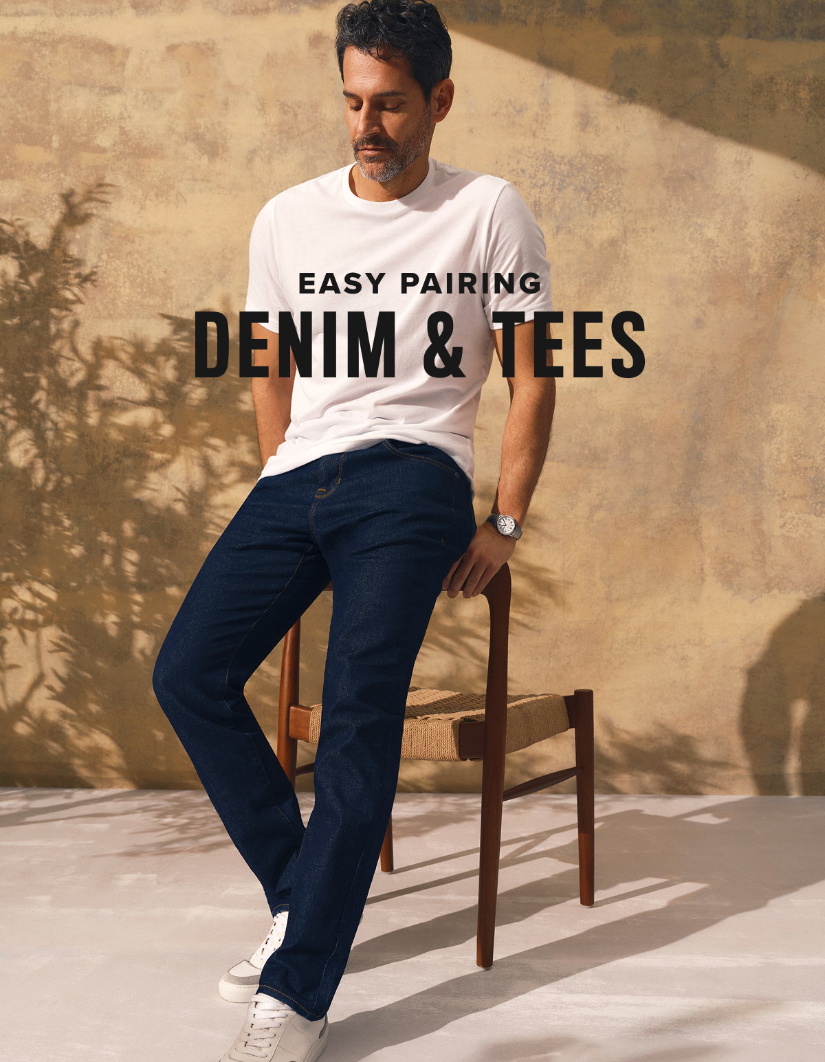 Model is wearing Slim Straight denim paired with a Ultrasoft white tee