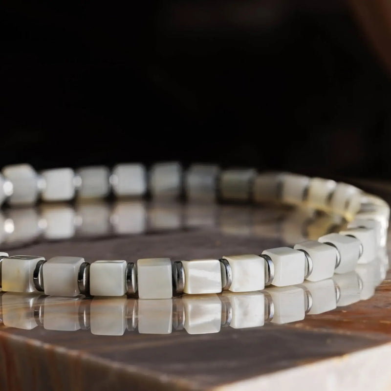 Mother of Pearl cube bracelet with a softly reflective surface.