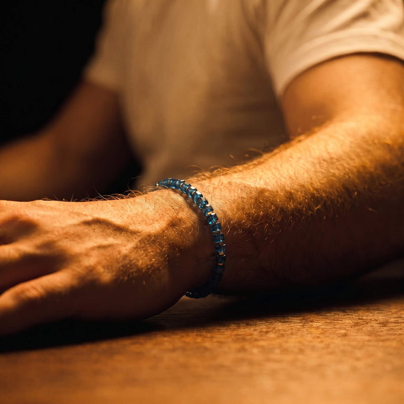 London Blue Topaz IV bracelet worn with a light shirt.