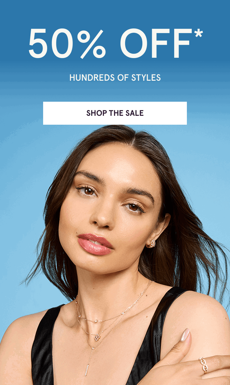 Model layered in dainty gold necklaces with diamond details. 50% OFF 100s of styles. Click here to shop the sale
