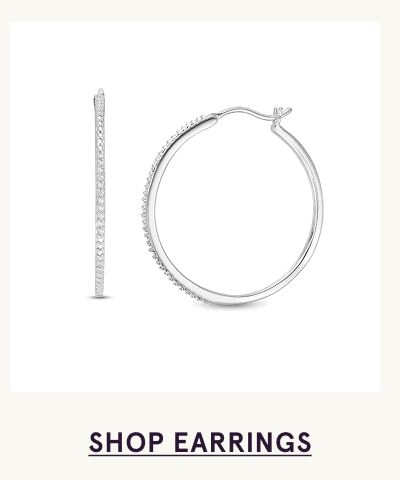 Pair of white-metal hoops lined with round diamonds along the front. Click here to shop earrings