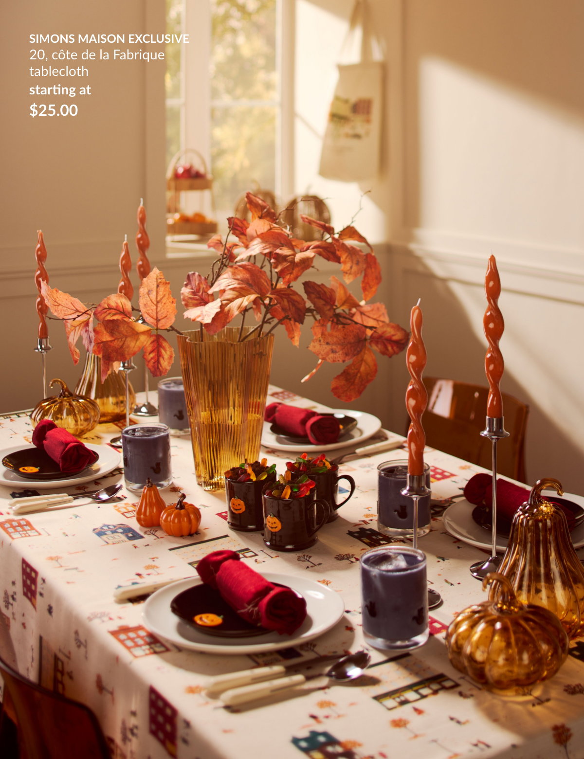 A large table decorated for Halloween, featuring, among other items, the 20, côte de la Fabrique tablecloth, starting at 25$.