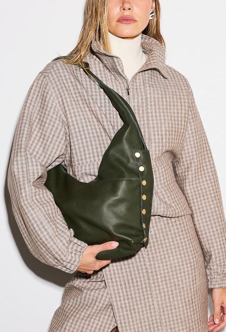 Carry it by the top handle or add the strap when the night picks up.