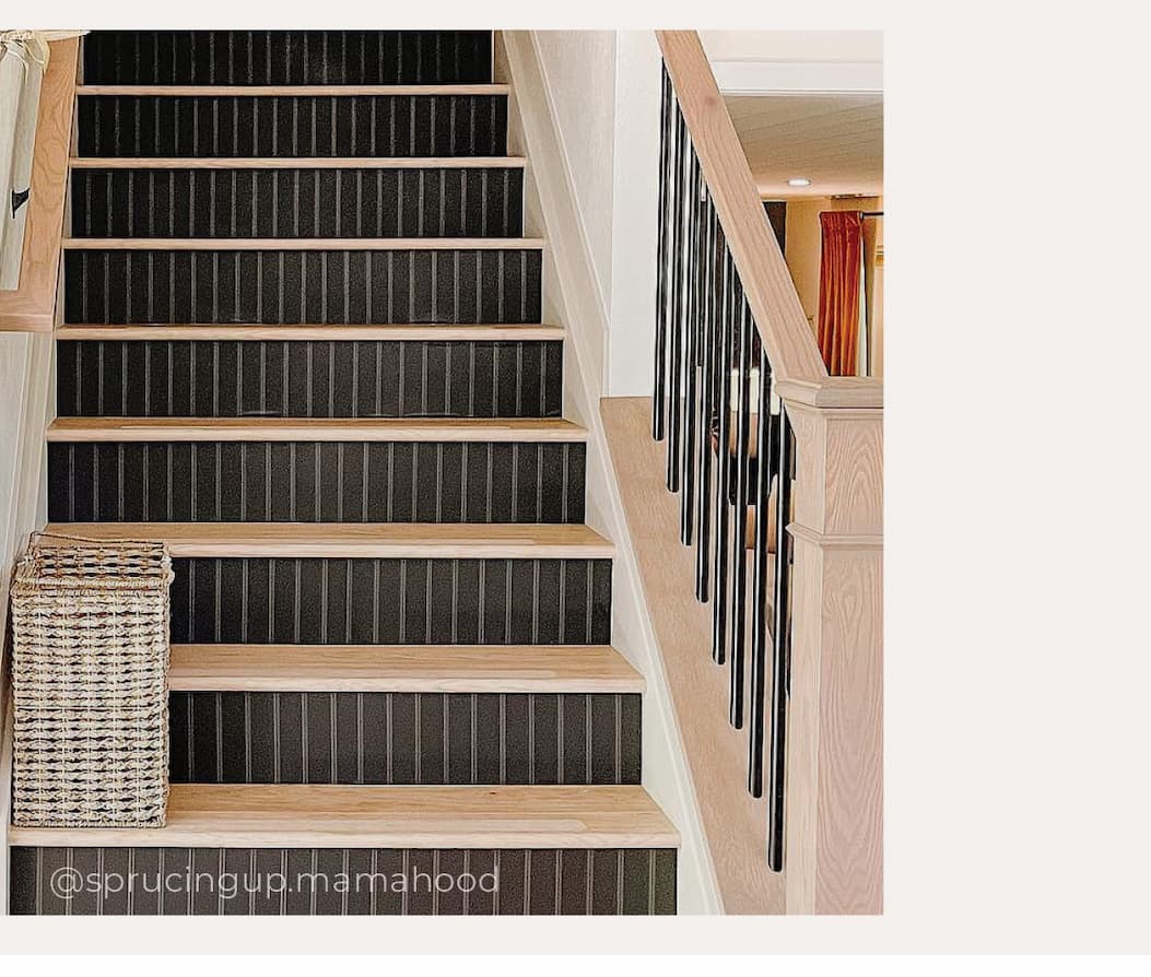 Image of Tempaper's beadboard wallpaper in black installed on stair risers