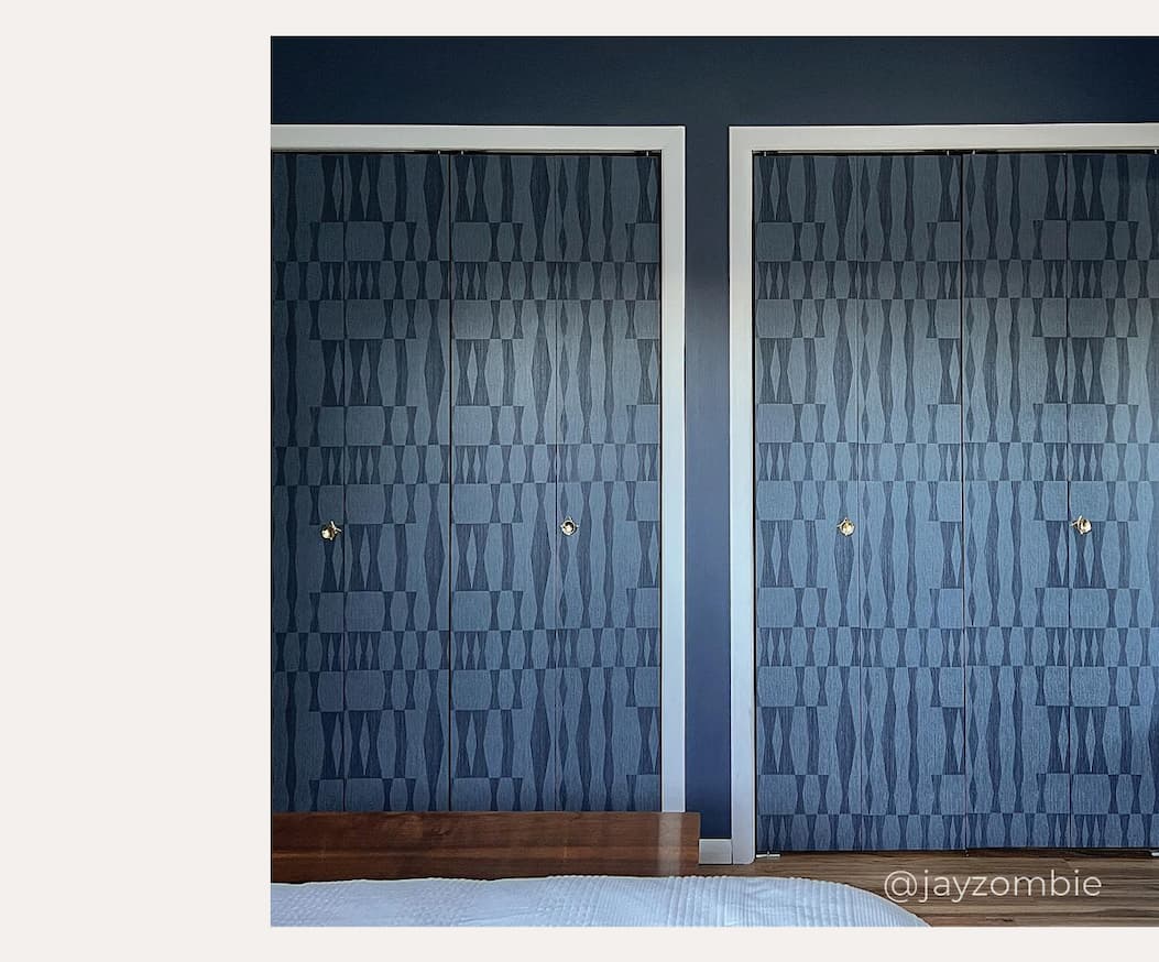 Image of Tempaper's Faux Grasscloth Geo in blue installed on closet doors.