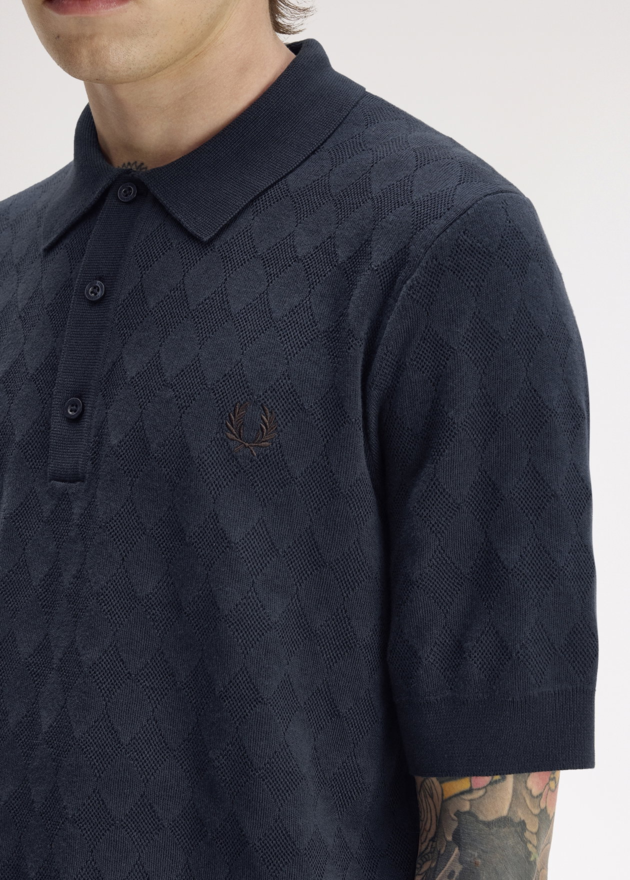 A close up of the Fred Perry Pointelle Knitted Shirt in Navy